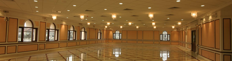 A fully lit hall at Najam Baug